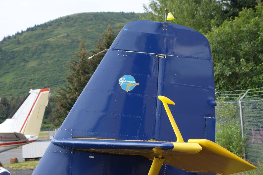 Picture of Grumman Logo on Vertical Stabilizer of yellow and blue Widgeon